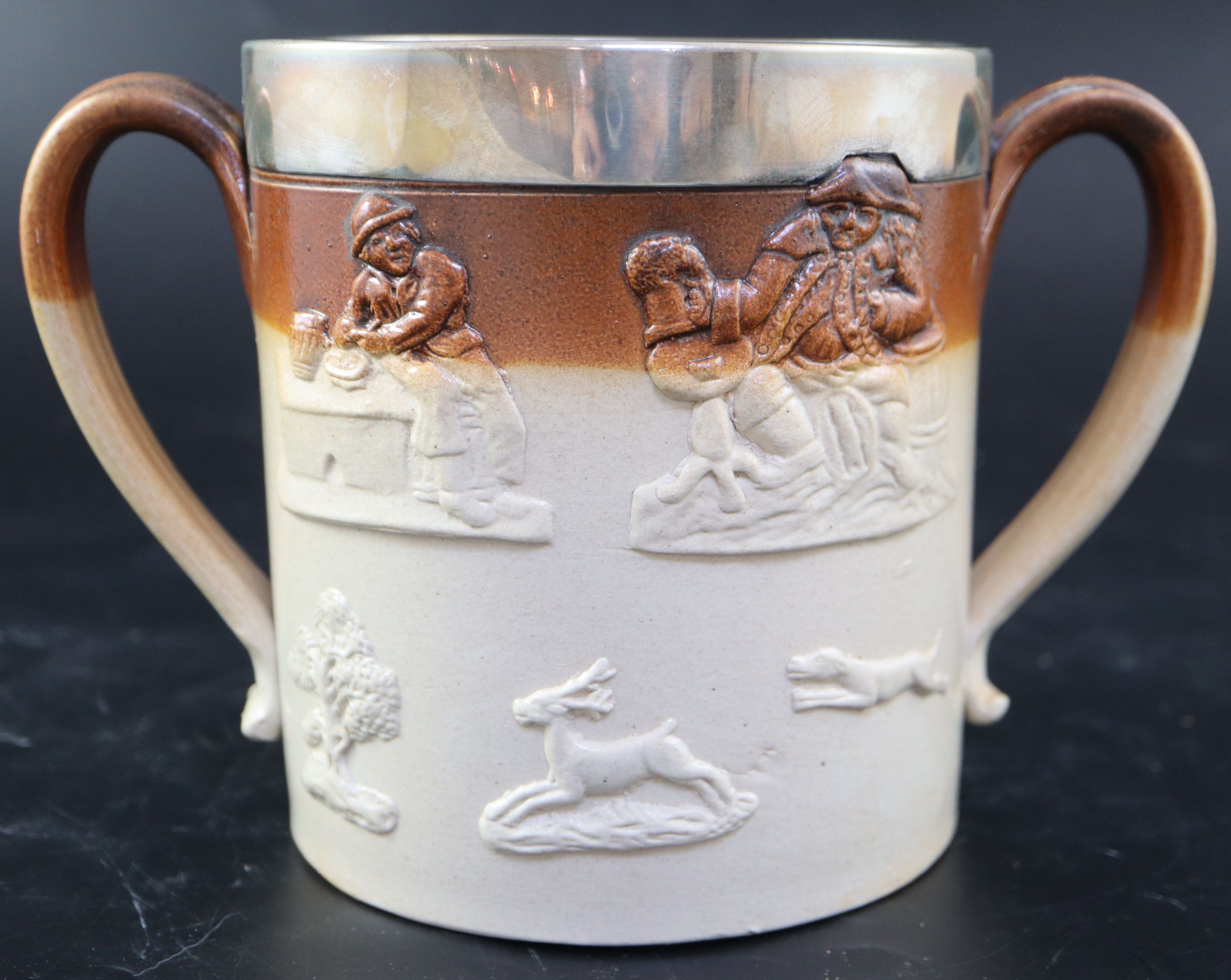 A Victorian silver mounted stoneware loving cup, width 22.5cm height 15cm